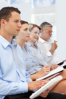 Group watching business presentation