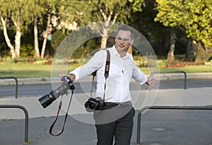 A group of wedding photographers on the streets of Budapest is holding a photo session for a couple of newlyweds.