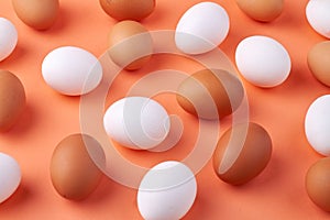 Group of white and brown raw chicken eggs.