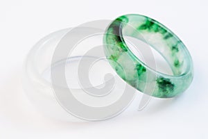 Group of white and green jadeite ring on white background