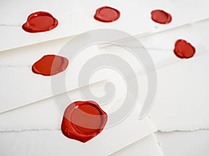 Group of white letters with red sealing wax