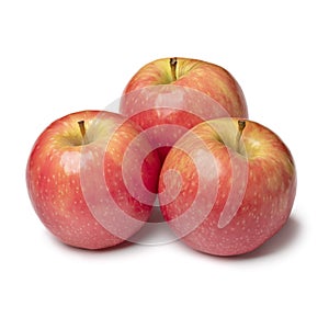 Group of whole fresh Pink Lady apples isolated on white background