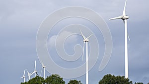 Group of wind turbines. Renewable energy. Electrical windmills. France countryside