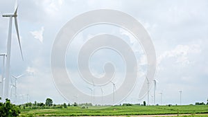 Group of wind turbines on the wind farm field. Electricity production industry, sustainable clean energy, environment conservation