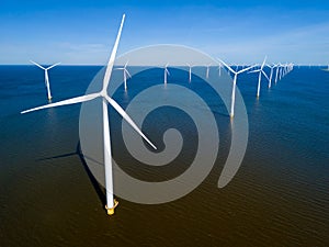 A group of windmills in the Netherlands Flevoland region during the vibrant season of Spring