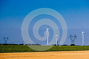 Group of windmills for renewable electric energy production and pylon