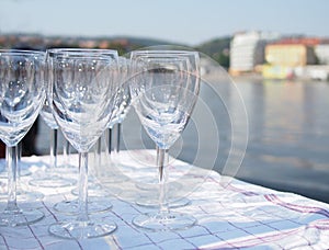 Group of wine glasses and a river