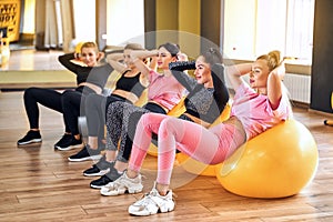Group of woman doing exercise on Fitness ball, Healthy lifestyle.