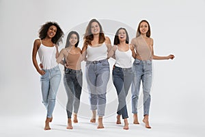Group of women with different body types on background photo