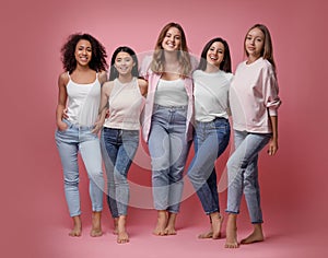 Group of women with different body types on background photo