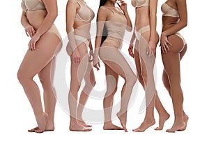 Group of women with different body types in underwear on background, closeup