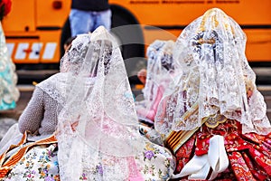 Group of women dressed in Valencian traditional dress, fallera costume photo