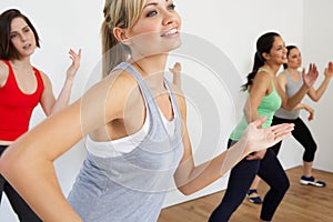 Group Of Women Exercising In Dance Studio