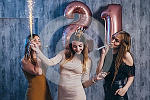 Group of women with fireworks at party having fun.