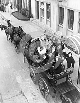 Group of women in horse drawn carriage