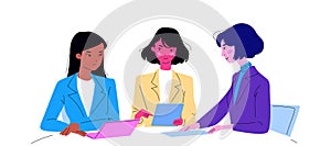 A group of women in an office meeting. Three young girls of different colors discussing work matters and developing a