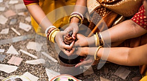 Group of women are performing Indian Bengali wedding rituals