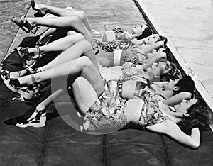 Group of women relaxing in a row together