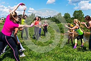 Group of women running outdoors having fun in nature