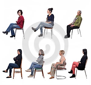 Group of women sitting on chair on white background, side view