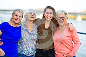 Group of women smiling outdoors photo