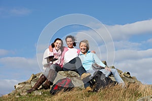 Group Of Women Stopping For Lunch On Countryside Walk