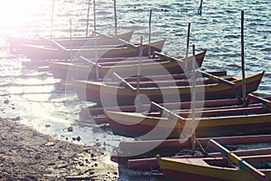 Group of wooden boats at lake Bali ,Indonesia. Filter:Vintage effected.