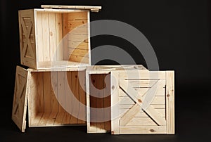 Group of wooden crates on black