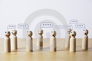 Group of wooden figure with comment message box cloud for customer feedback or group discussion for problem solving concept