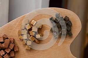 Group of wooden toy cubes as  educational game object on palette