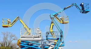 Group of work aerial platforms,  cherry pickers and scissor lifts models photo