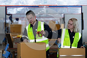 Group of worker in auto parts warehouse Packing small parts in boxes after inspecting the car parts that are ready