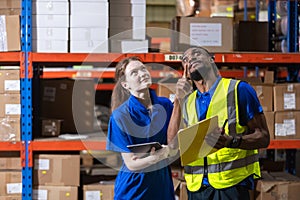 Group worker warehouse working brainstorm checklist product to shelf in warehouse store. Logistics factory industry supervisor