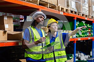 Group worker warehouse working brainstorm checklist product to shelf in warehouse store. Logistics factory industry supervisor