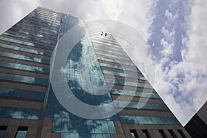 Group of workers cleaning windows service