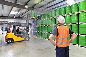 Group of workers in the logistics industry work in a warehouse w