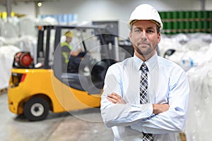 Group of workers in the logistics industry work in a warehouse w