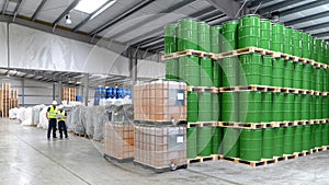 Group of workers in the logistics industry work in a warehouse w