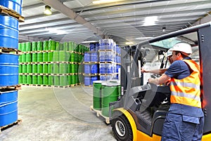 Group of workers in the logistics industry work in a warehouse w