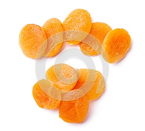 Group of yellow dried apricots isolated on white background