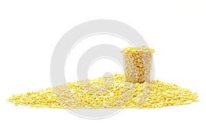 A group of yellow peeled mung bean in the glass shallow focus