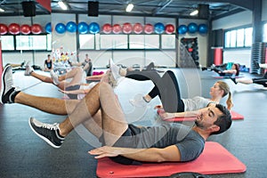 Group young adults having fitness class