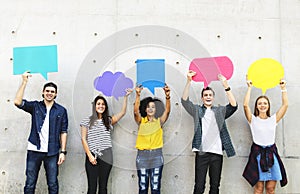 Group of young adults outdoors holding empty placard copyspace t