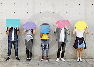 Group of young adults outdoors holding empty placard photo