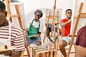 Group of young african american artist man smiling happy drawing at art studio