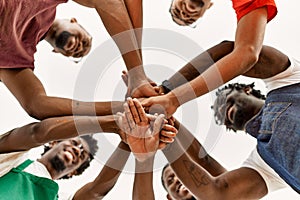 Group of young african american artist man smiling happy with hands united at art studio