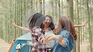 Group of young asia camper friends camping near relax enjoy moment in forest. Happy female traveler traveler success and fun at