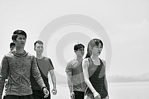 Group of young asian adults walking outdoors