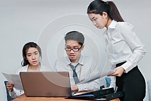 Group of young Asian business people working together in the office. Business teamwork cooperation partnership concept