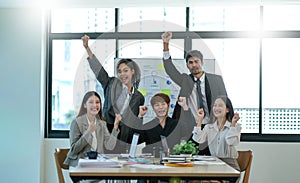 Group of Young Asian business team creative business people coworker in office Happy to be successful partnership teamwork